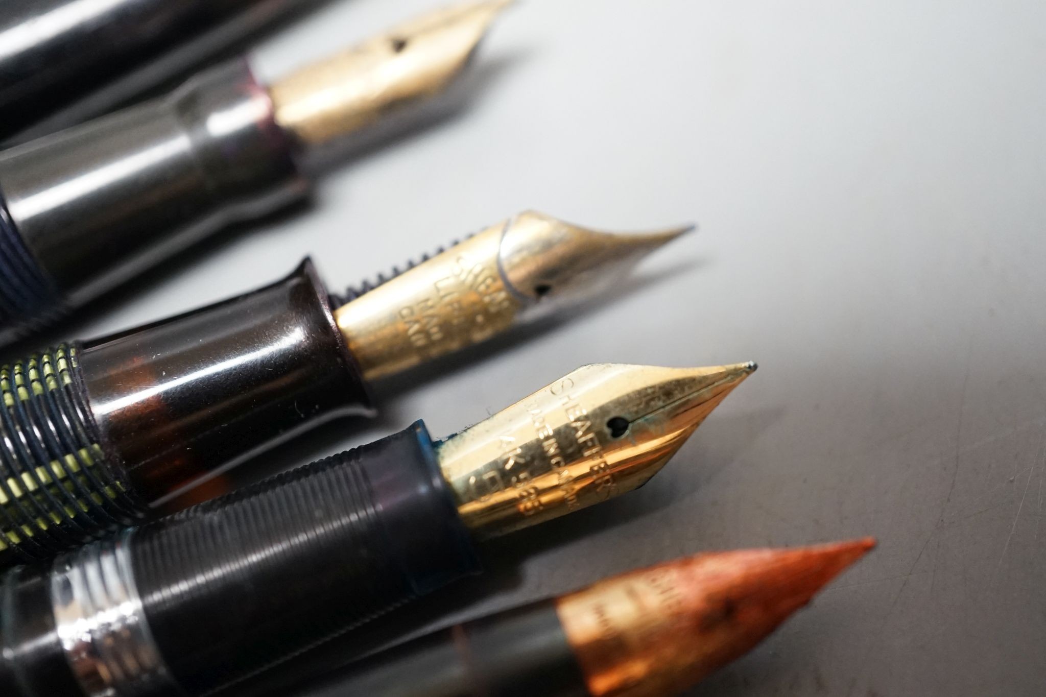 Seven assorted pens including fountain pen with 18ct gold nib.